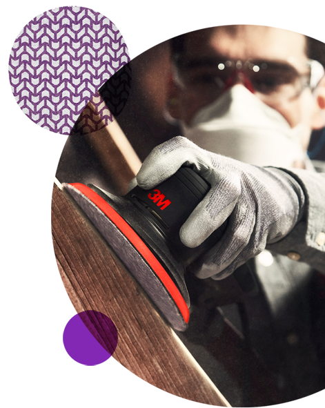 Man using a 3M sander on wood